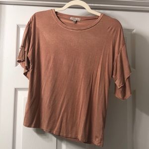 Salmon/peach colored top with ruffle sleeves